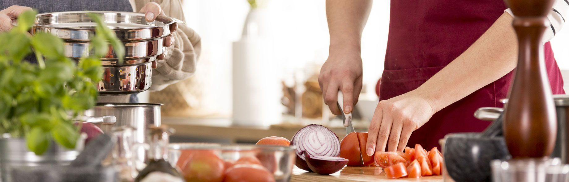 Woman cutting up vegetables for dinner